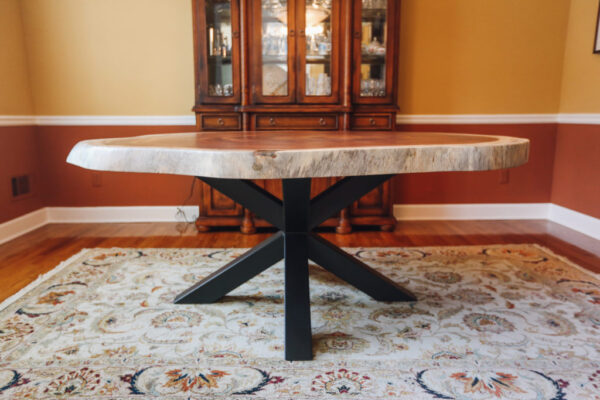 Introducing our Live Edge Crosscut Dining Table, a stunning centerpiece marrying the raw, natural beauty of live edge wood with precision crosscut design, offering a unique and organic focal point for your dining space.